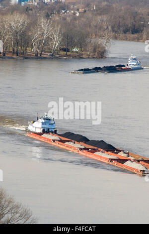 US, WV, Parkersburg. Coal barges navigate up Ohio River seen from historic Fort Boreman Park. Blennerhassett Island in river is historical state park Stock Photo