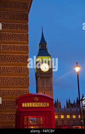 Big Ben clock tower of Houses of Parliament with traditional red K6 telephone box in foreground London England UK Stock Photo