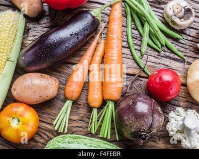 Fresh organic vegetables on the wooden table. Top view. Stock Photo