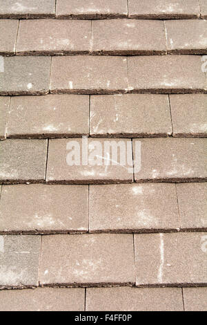 X mark on roof tiles to signify row of tiles to nail to wooden battens to prevent slippage Stock Photo