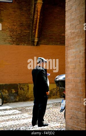 Man standing on a street in Bologna Italy Stock Photo