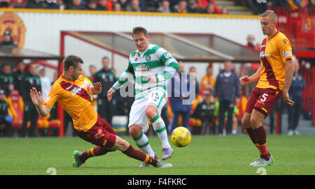Fir Park, Motherwell, Scotland. 17th Oct, 2015. Scottish Premier League. Motherwell versus Celtic. Stephen McManus puts in a late tackle on Kris Commons Credit:  Action Plus Sports/Alamy Live News Stock Photo