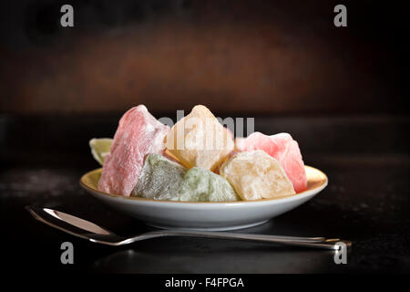 Turkish Delight on plate over rustic background Stock Photo