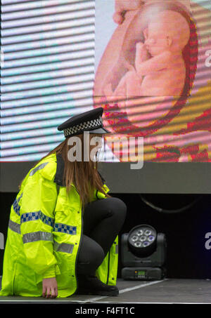 Liverpool, Merseyside, UK 17th October, 2015.  Surprise anti-crime performance by MD Productions. The event, organised by Merseyside police, aimed to raise awareness of the dangers and consequences of girls and young women getting involved in gangs. Videos, banners and campaign visuals were used to encourage people to visit Tough Call’s website, which supports girls, and women who may be involved in gangs and their families and friends who may be worried about them. Stock Photo