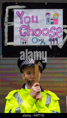 Liverpool, Merseyside, UK 17th October, 2015.  Surprise anti-crime performance for shoppers,  by Laura Finnigan, 18 years old, of  MD Productions. The event, organised by Merseyside police, aimed to raise awareness of the dangers and consequences of girls and young women getting involved in gangs. Videos, banners and campaign visuals were used to encourage people to visit Tough Call’s website, which supports girls, and women who may be involved in gangs, gun crime and their families and friends who may be worried about them. Stock Photo