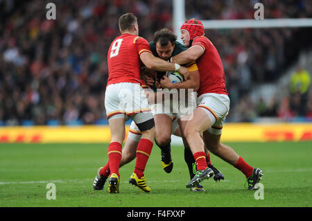 London, UK. 17 October 2015: Bismarck Du Plessis of South Africa is tackled by Gareth Davies and Tyler Morgan of Wales.during Match 41 of the Rugby World Cup 2015 between South Africa and Wales - Twickenham Stadium, London.(Photo by: Rob Munro/Stewart Communications/CSM) Credit:  Cal Sport Media/Alamy Live News Stock Photo