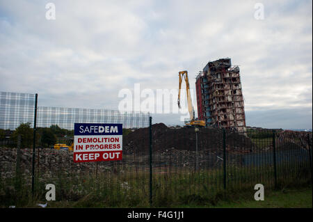 Glasgow, Scotland 11th of October 2015. The demolition of the Red Road Flats that were partially demolished is currently being demolished with heavy machinery due to the two remaining towers that did not fully come down with the explosion. Piles of rubble are in place of where the towers stood Credit:  Andrew Steven Graham/Alamy Live News Stock Photo