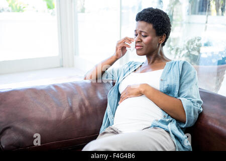Pregnant woman crying from pregnancy pains Stock Photo
