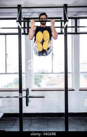 Fit man doing pull ups Stock Photo