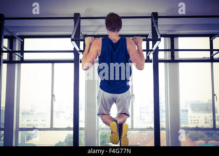 Fit man doing pull ups Stock Photo