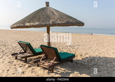 Chairs and umbrella on a tropical beach Stock Photo