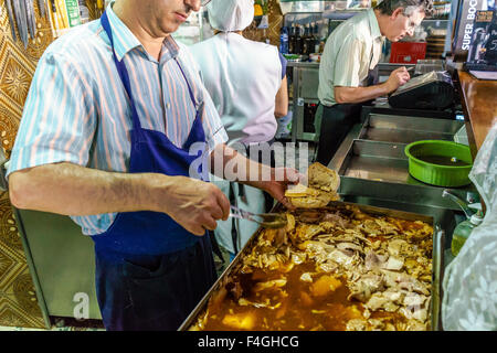 Man makes famous pulled pork sandwiches. October, 2015. Porto, Portugal. Stock Photo