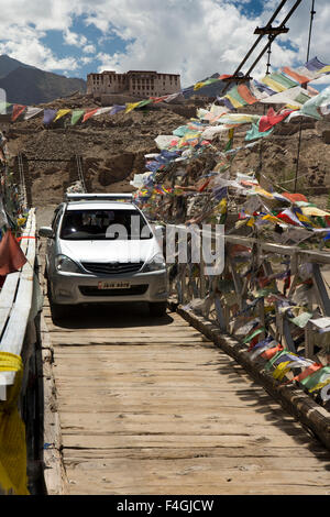 India, Jammu & Kashmir, Ladakh, Stakna, car crossing narrow suspension bridge across River Indus, near Gompa Stock Photo