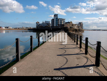 View along Marine Lake Causeway to Knightstone Island, Weston-super-Mare, Somerset, UK Stock Photo