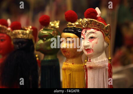 Phuket, Thailand. 18th October, 2015. Gods statue in a shrine during the Phuket Vegetarian Festival.  The Phuket Vegetarian Festival begins on the first evening of the ninth lunar month and lasts nine days, religious devotees slash themselves with swords, pierce their cheeks with sharp objects and commit other painful acts to purify themselves. Credit:  John Vincent/Alamy Live News Stock Photo