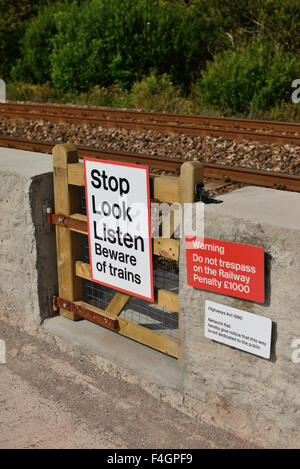 Warning sign beside railway line. Stock Photo
