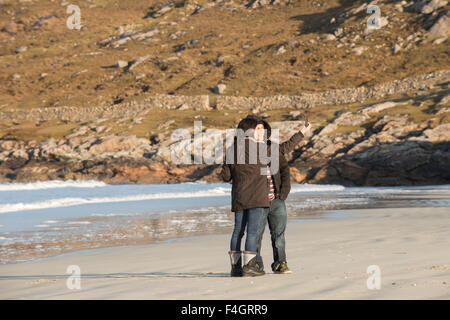 Young couple taking a selfie on a beach Stock Photo