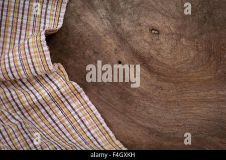 the checkered tablecloth on wooden table Stock Photo
