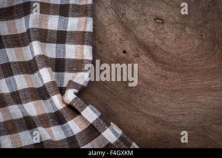 the checkered tablecloth on wooden table Stock Photo