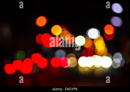 Artistic style - Defocused urban abstract texture bokeh city lights in the background with blurring lights for your design Stock Photo