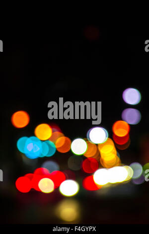 Artistic style - Defocused urban abstract texture bokeh city lights in the background with blurring lights for your design Stock Photo