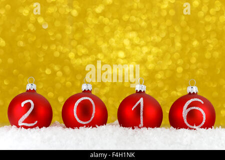 2016 New year text on christmas baubles Stock Photo