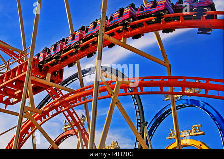 Roller coaster, close up, full enjoyment of the thrill of speed at Oktoberfest in Munich Stock Photo