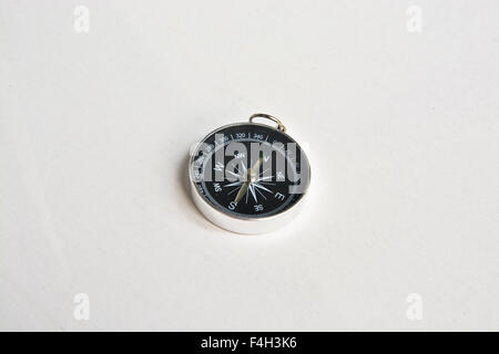 Compass. Photo of magnetic compass on white background. Stock Photo