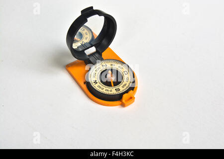 Compass. Photo of magnetic compass on white background. Stock Photo