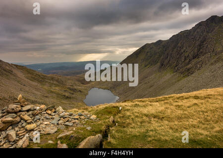 Looking into Goat's Water from the Col between Dow Crag and the Old Man of Coniston on a moody autumnal day Stock Photo