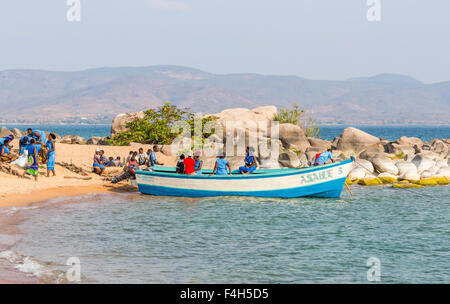 Boat bringing provisions for the local village on the lakeside beach, Likoma Island, Lake Malawi, Malawi, south-east Africa Stock Photo