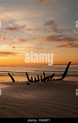 Shipwreck at sunset on Seton Sands Stock Photo - Alamy