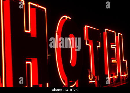 Red neon sign with the word Hotel in the night Stock Photo