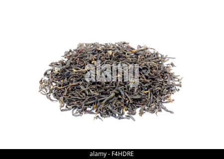 Heap of loose black tea Assam isolated on white background Stock Photo