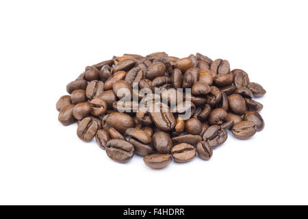 Heap of whole brown coffee beans isolated on white background