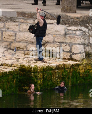 18 year old 'Game of Thrones' star Maisie Williams suffers for her art as she takes a plunge into the chilly waters of the Irish Sea in character as young Arya Stark while filming continues for season 6 of the hit US TV show in Carnlough Harbour, Northern Stock Photo