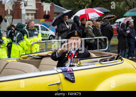 Melbourne, Australia - April 25, 2015: A war veteran is being driven around and is waving at people at the ANZAC Day parade. Stock Photo