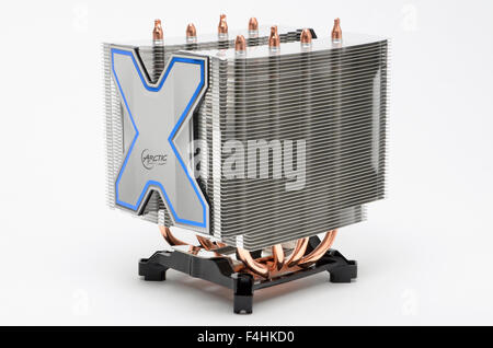 Arctic Cooling Freezer Xtreme CPU cooler and mounting cradle. Central cooling fan removed to show twin heatsink towers. Stock Photo