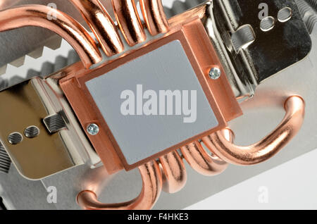 Pre-applied MX2 thermal compound and copper heat pipes on the underside of an Arctic Cooling Freezer Xtreme CPU cooler. Stock Photo