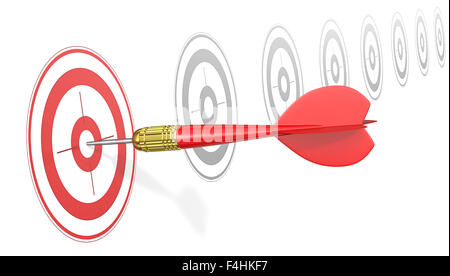 Red Dart Arrow hitting center of red target. Angle view. Stock Photo