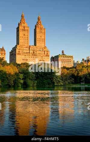 Manhattan Upper West Side across Central Park Lake on Autumn morning. New York City Stock Photo