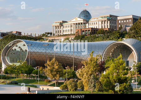 The Rike Park Theater and Exhibition Hall and the Presidential Palace (background) in Tbilisi, the capital of Georgia. Stock Photo