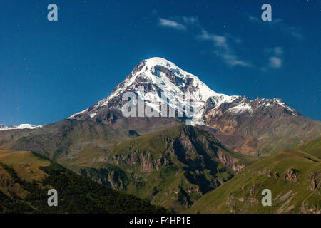 Moonlit view of Mount Kazbek (5047m) in the Caucasus Mountains of northern Georgia. Stock Photo