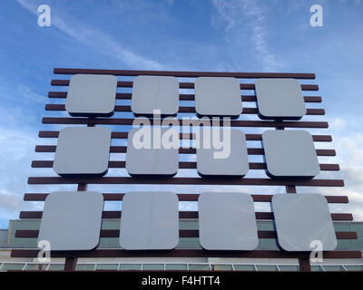 Empty big billboard at shopping mall, isolated over blue sky Stock Photo