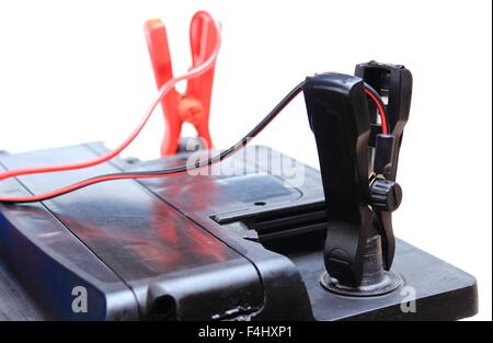 Charger with cables uses to charge old dead car battery Stock Photo