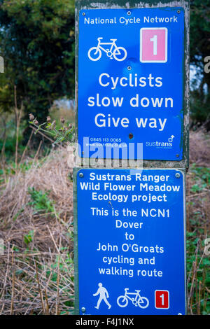 National Cycle Network NCNI Route 1 Dover to John o’Groats Sign warning cyclists to slow down and give way (to pedestrians). Stock Photo