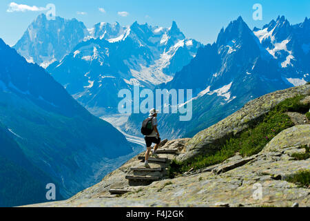 Hikers in the Aiguilles Rouges National Nature Reserve, view at the peaks Grandes Jorasses und Dent du Géant, Chamonix, France Stock Photo