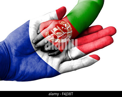 Flag of France overlaid the hand of an adult man holding a baby hand with the flag of Afghanistan overprinted Stock Photo