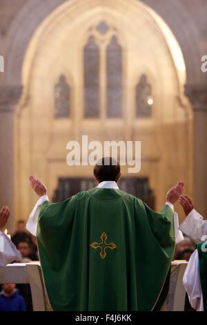 Eucharist, priest in Catholic Mass, Notre-Dame du Perpetuel Secours Basilica, Paris, France, Europe Stock Photo