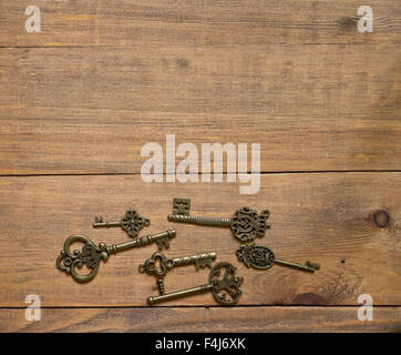 old keys on wooden background Stock Photo
